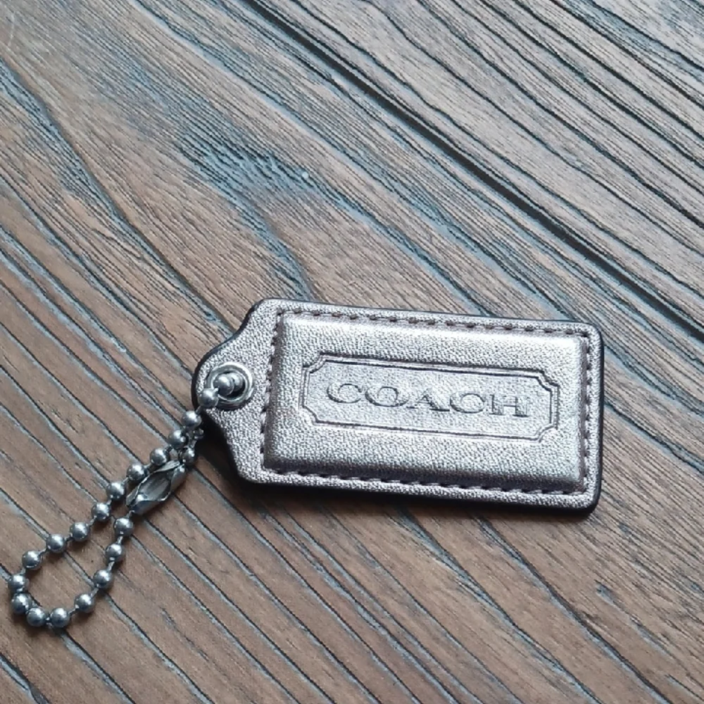 Coach Matallic Gold Color Keychain Tag